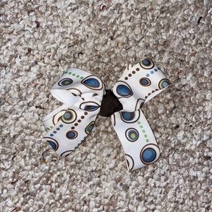 Polka-dot blue green brown and white bow